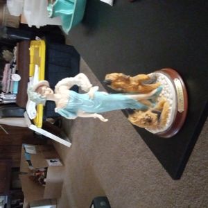 LA Verona statue a beautiful  girl in a blue dress with her lovely dogs.